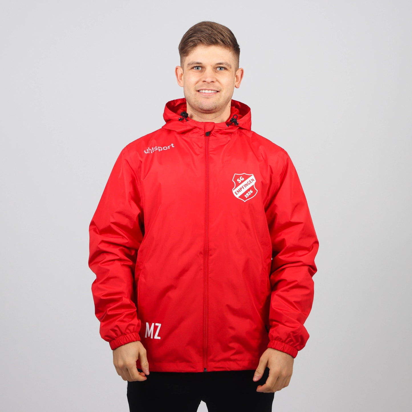 UHLSPORT Regenjacke ESSENTIAL (inkl. Bedruckung) - Rot/Weiss - SG Empfingen