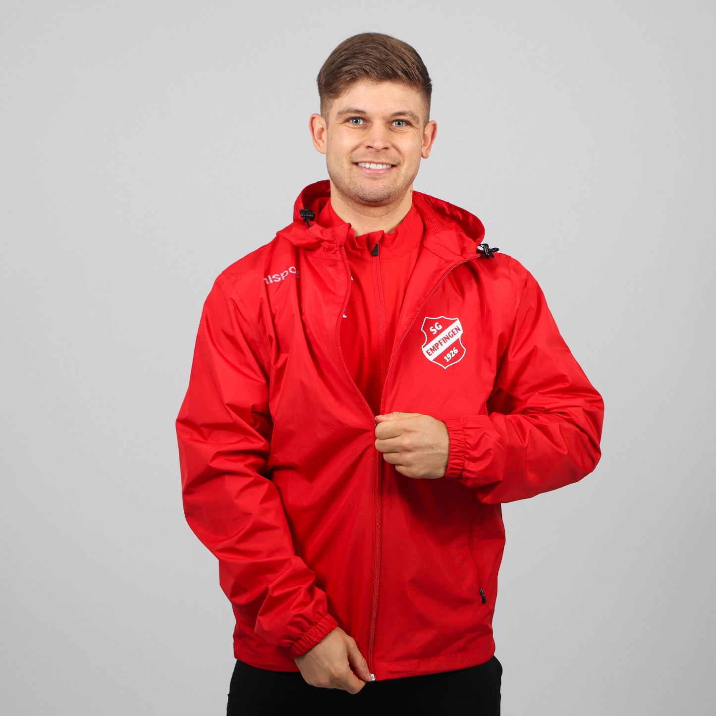 UHLSPORT Regenjacke ESSENTIAL (inkl. Bedruckung) - Rot/Weiss - SG Empfingen