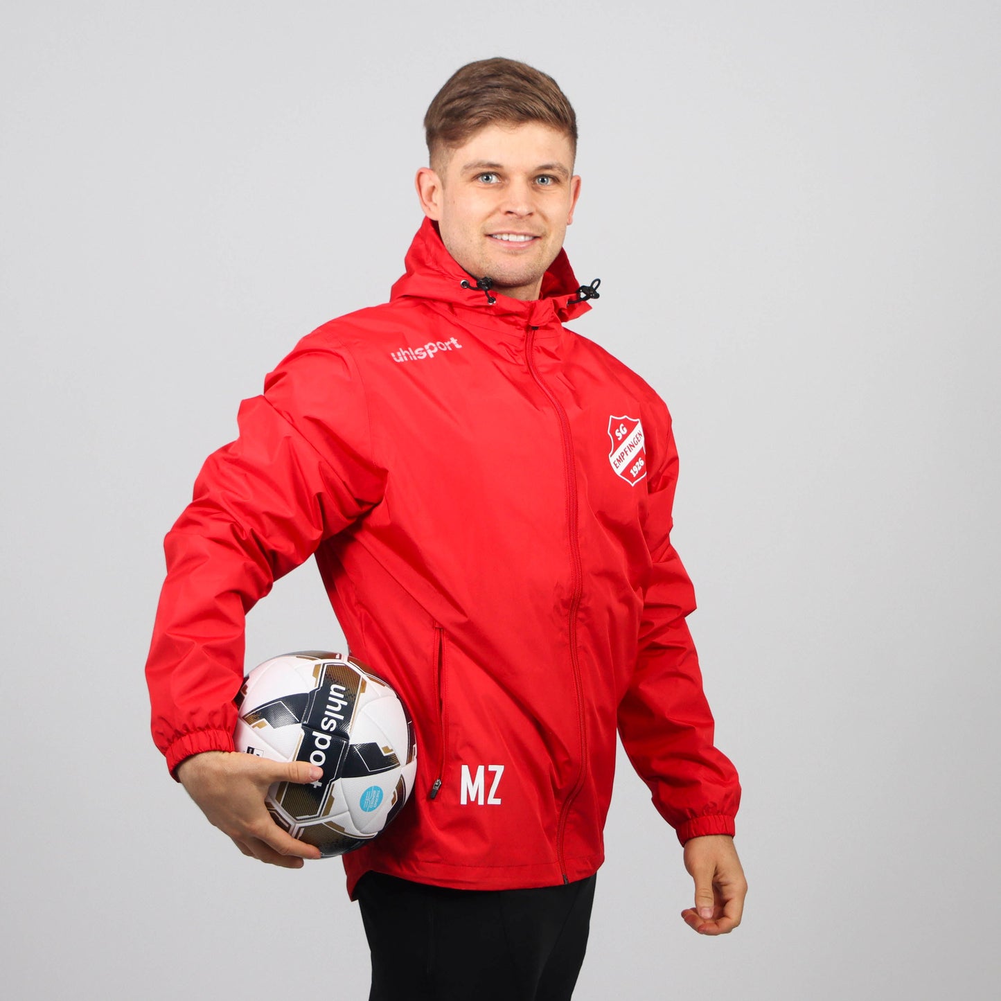 UHLSPORT Regenjacke ESSENTIAL (inkl. Bedruckung) - Rot/Weiss - SG Empfingen